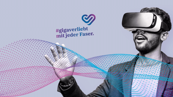 Ein staunender Mann mit VR-Brille als Symbol für den medl-Geschäftsbereich Glasfaser